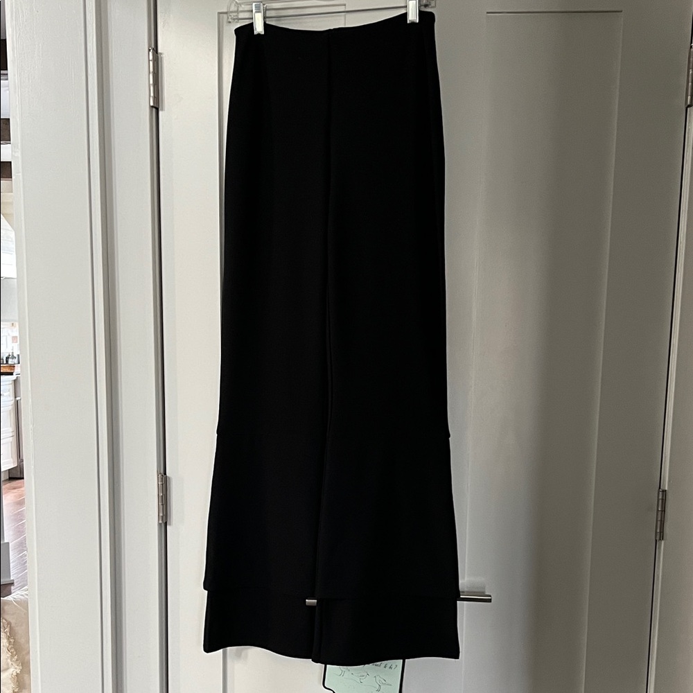 Elegant Black full length pant. Elastic waist for full comfort. Size medium.